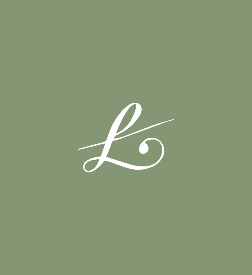 Monogramme calligraphié Elevent Studio en blanc sur vert sauge